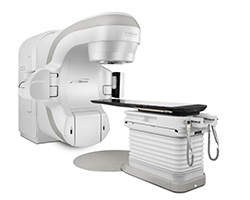 the TrueBeam Linear Accelerator is a large machine with a table for patients to lay on